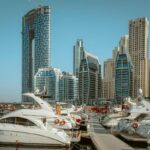 dubai growing bigger than abu dhabi